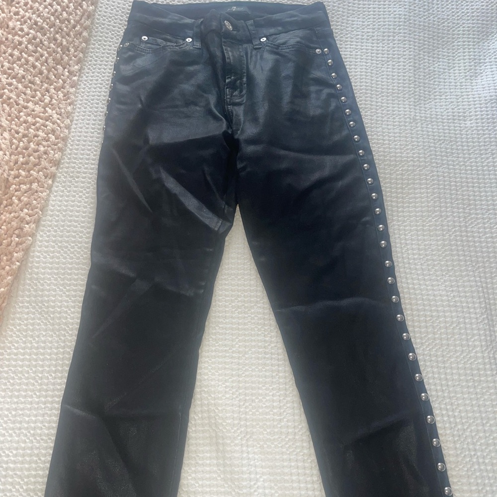 7 for all Mankind shiny leather jeans with silver detailing on both sides.